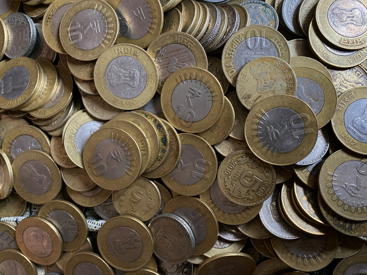 pile of Indian coins